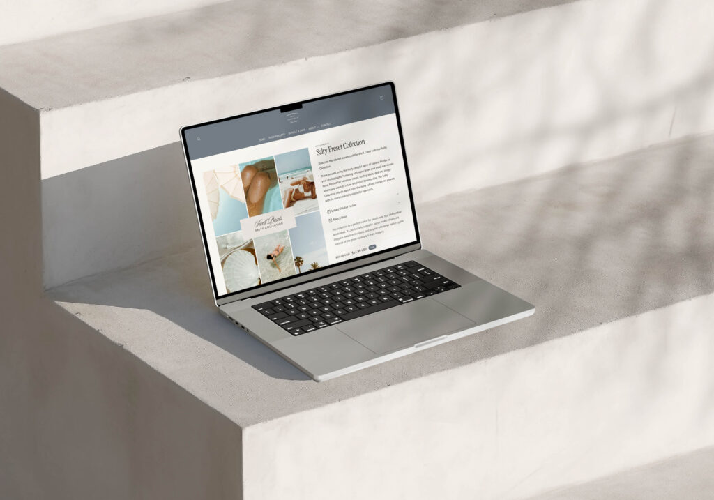 Showit Website Designs | High Tide Strategy Full Service Marketing Agency | A laptop on sunlit concrete steps displays a website with beach-themed images and text. Shadows cast patterns, creating a calm, minimalist tone.