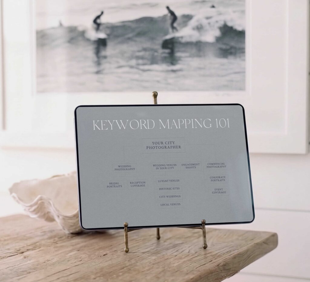 Ipad holds a keyword mapping example for SEO for Photographers. In a coastal office by High Tide Strategy Mandy Ford. 