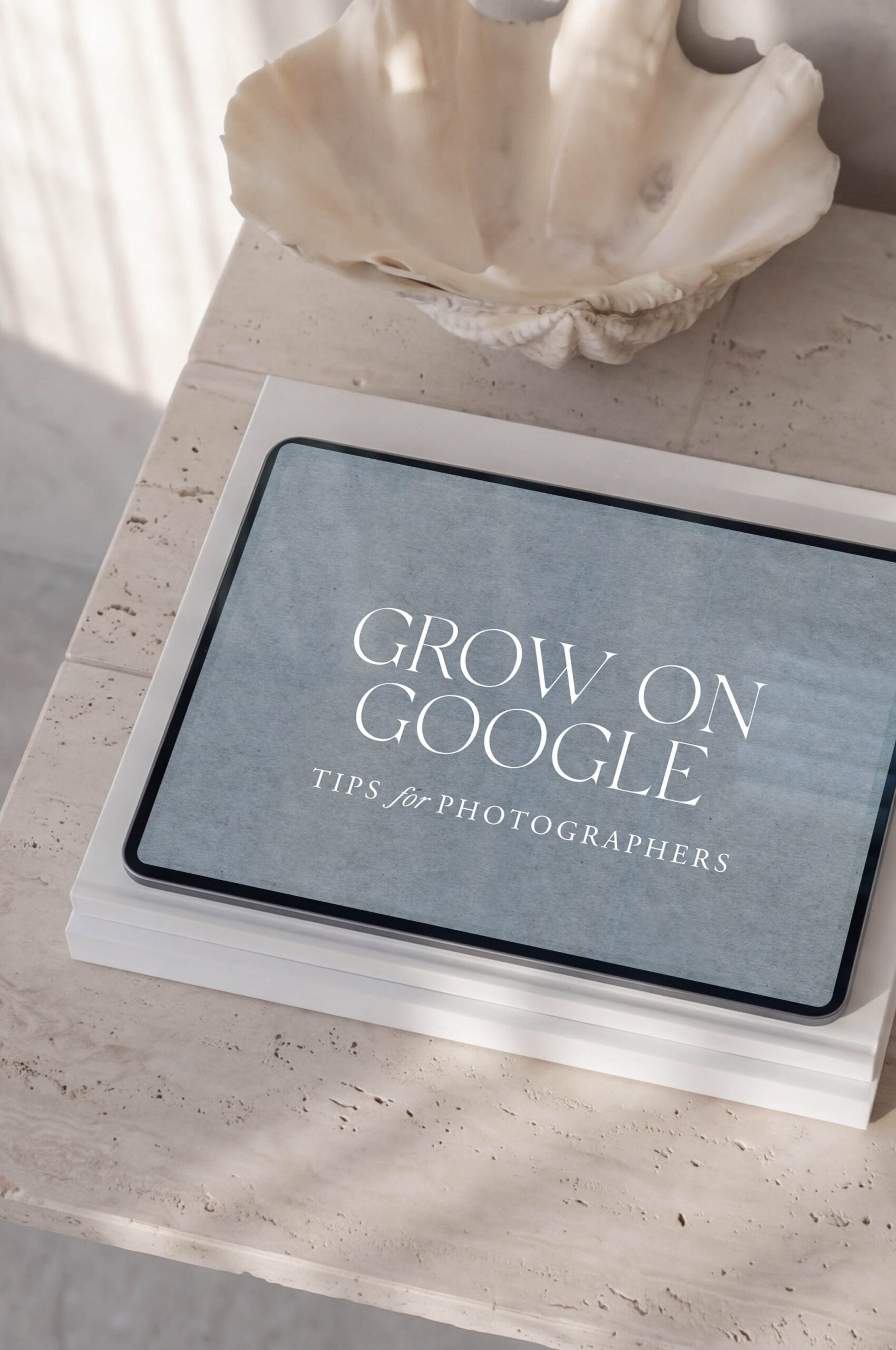 Ipad on desk with the words "Grow On Google" by SEO expert for photographers Mandy Ford
