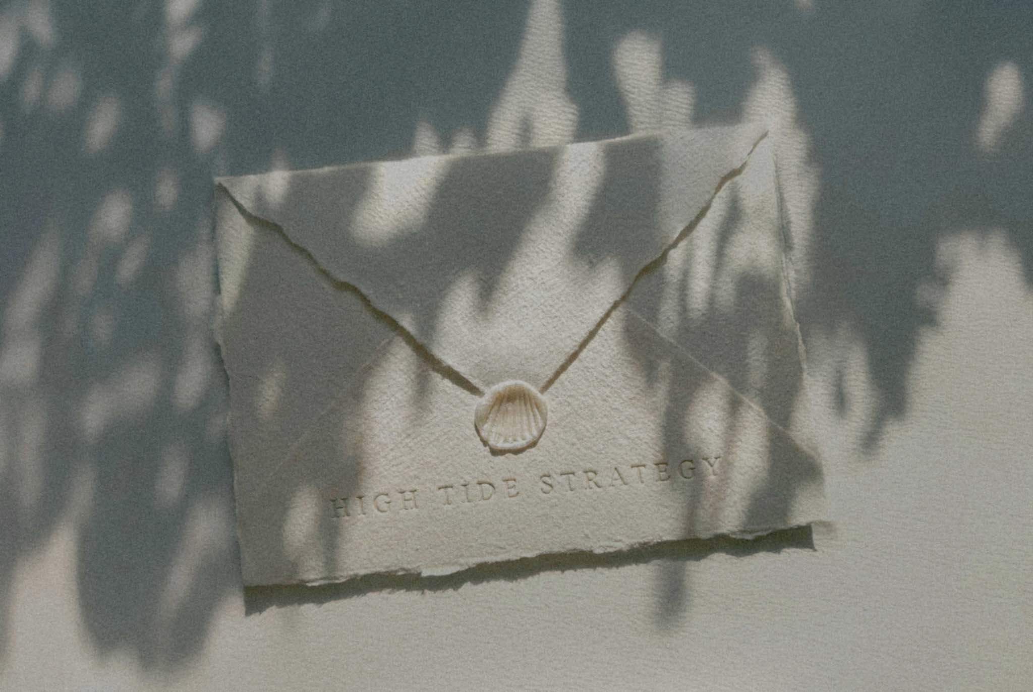 envelope showcasing High Tide Strategy - an SEO Expert For Photographers with a wax shell and filtered light
