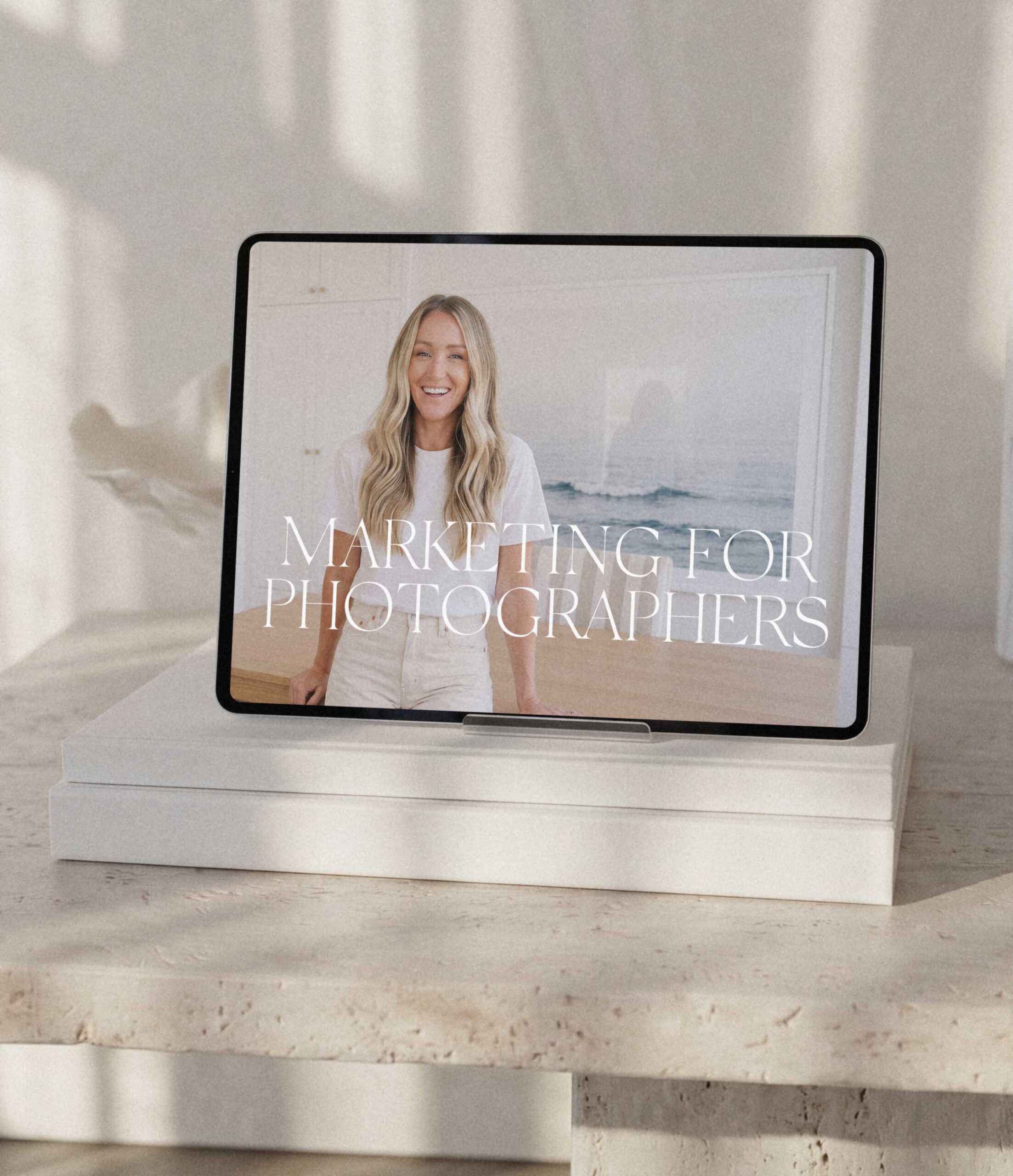 ipad on white books marketing for photographers by seo expert mandy ford