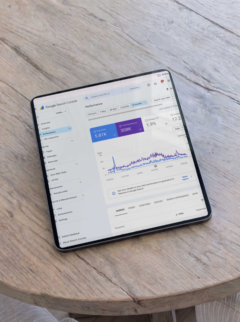 google search console seo stats for photographers on an ipad on a wood table by high tide strategy mandy ford